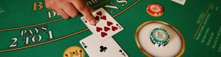 link indotogel desktop live-dealer interface showing baccarat table with dealer video feed and balance display